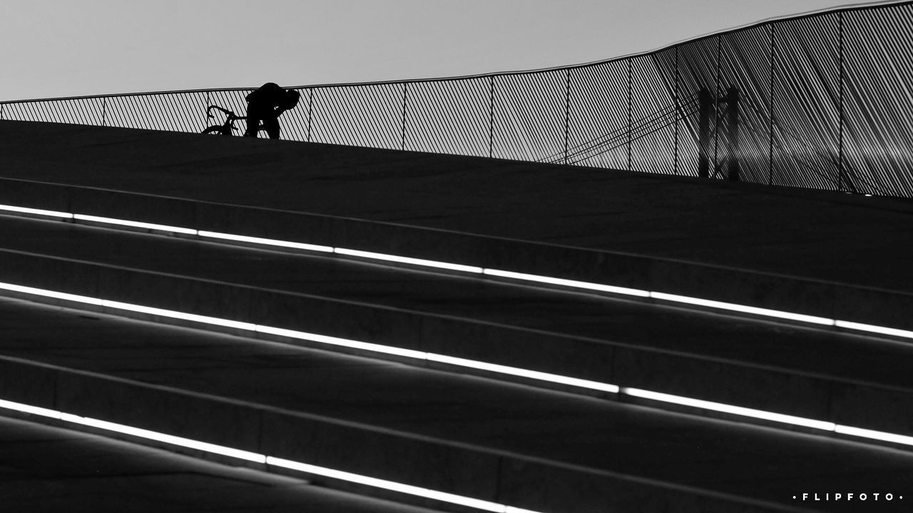 MAN WALKING ON ROAD