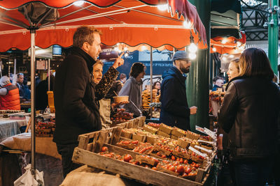 People at market stall