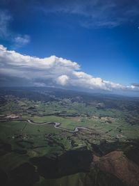 Aerial view of agricultural landscape against sky