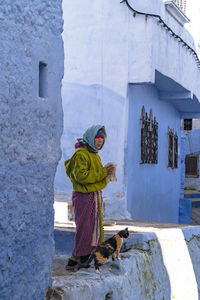 Full length of woman standing in snow