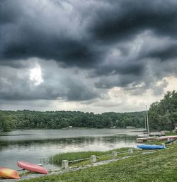 Scenic view of lake against cloudy sky