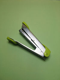 High angle view of shoes on table against green background