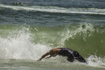 Man swimming in sea