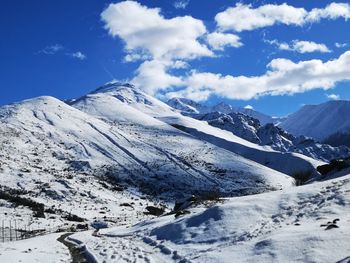 Scenic view of snowcapped mountains against sky