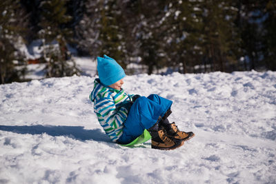 Rear view of boy in snow