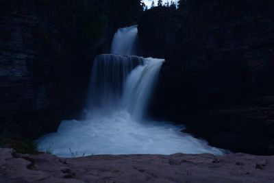 Scenic view of waterfall in forest