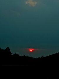 Silhouette of trees against sky at sunset