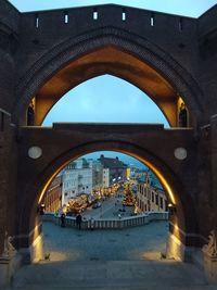 Arch bridge over canal in city