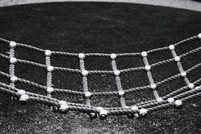 Close-up side view of jungle gym ropes