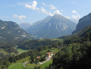 Scenic view of landscape and mountains against sky