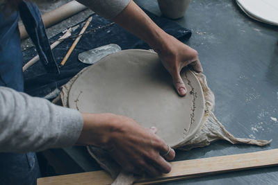 Midsection of woman working in workshop