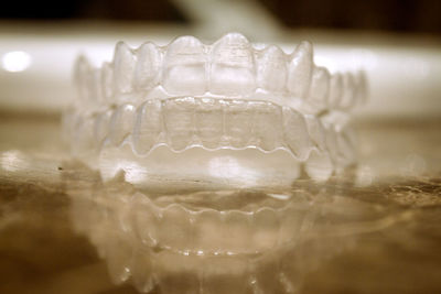 Close-up of artificial teeth on table