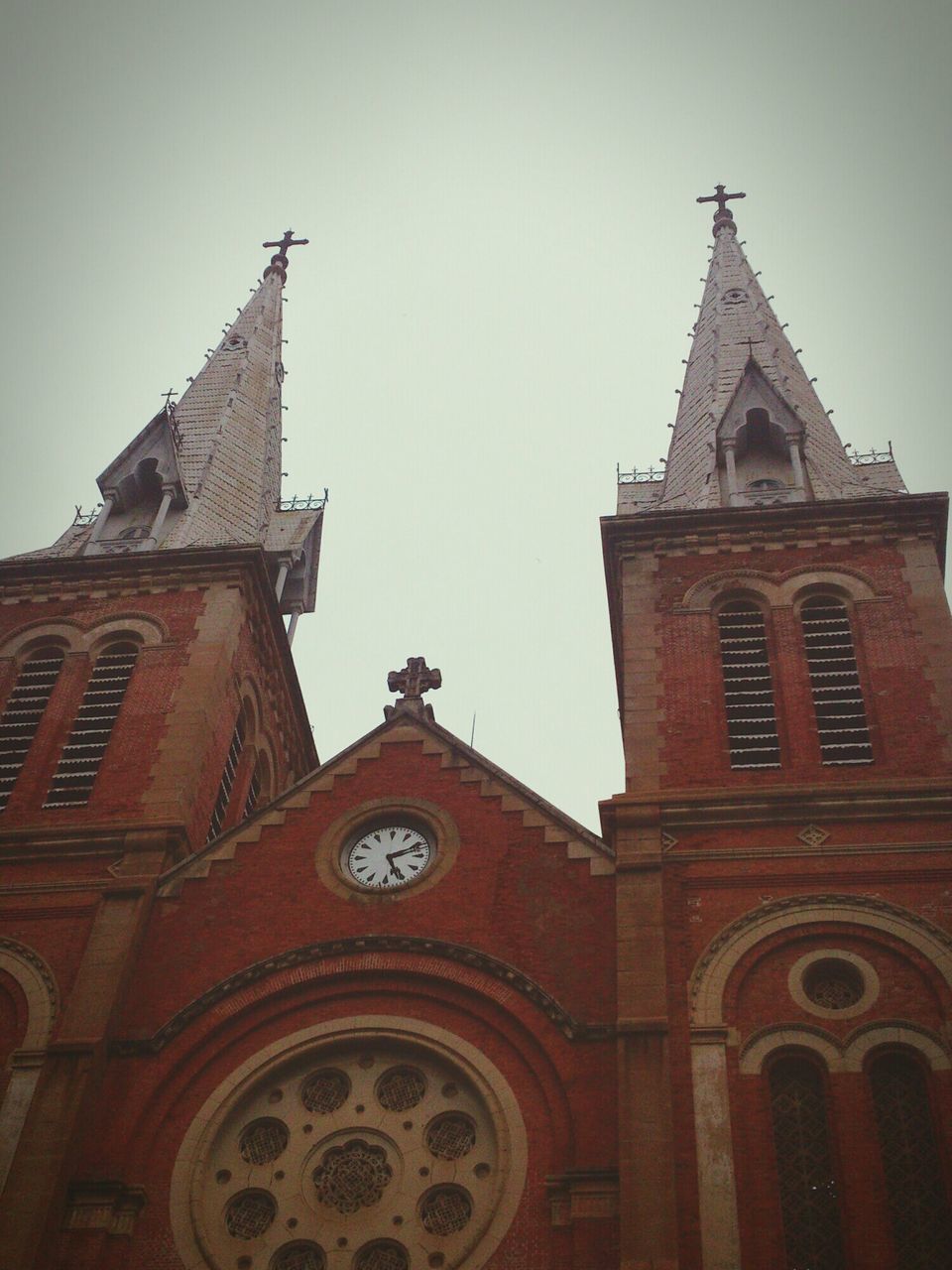 religion, church, building exterior, architecture, place of worship, built structure, spirituality, low angle view, cross, cathedral, clear sky, clock tower, clock, sky, tower, high section, steeple, day