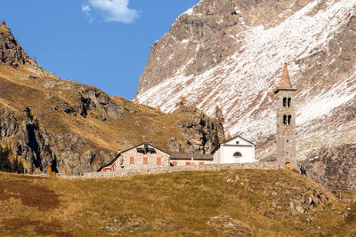 Panoramic view of church and buildings against sky