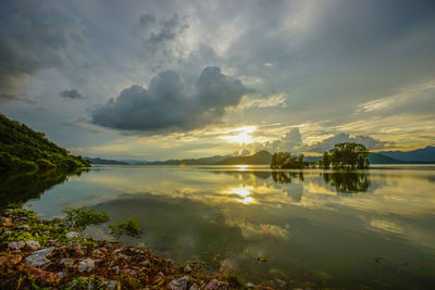 Scenic view of lake against sky during sunset