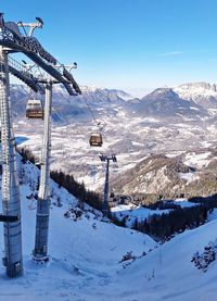 Scenic view of snow covered mountains against sky during winter