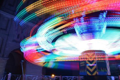 Low angle view of illuminated lights at night