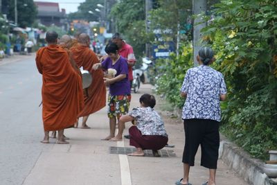 Rear view of man walking on street