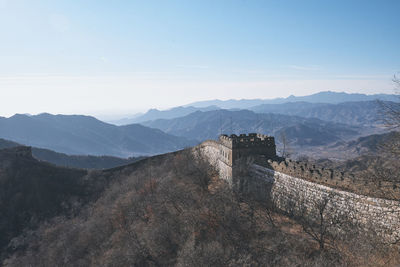 View of great wall of china against sky with mountains in the background
