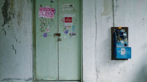 Text on closed door of old building