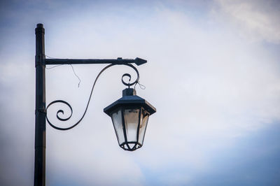 Low angle view of street light against sky