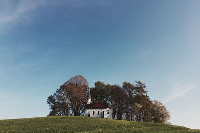 Low angle view of built structure against blue sky