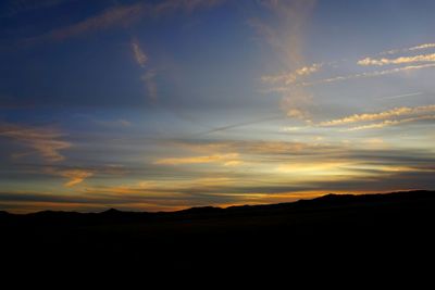 Scenic view of silhouette landscape against sky during sunset