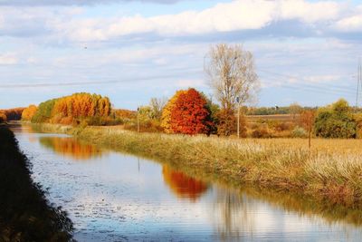 Scenic view of lake against sky during autumn