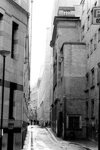 Lane amidst buildings in city