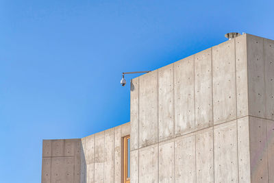 Low angle view of building against clear blue sky