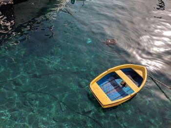 High angle view of boat floating on lake