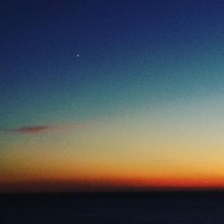 Scenic view of sea against sky at sunset