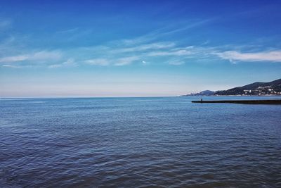 Scenic view of sea against blue sky