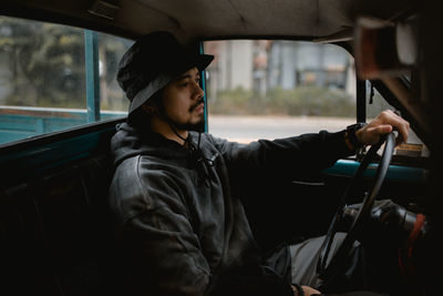 Man sitting in car