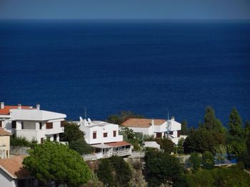 Residential buildings against blue sky