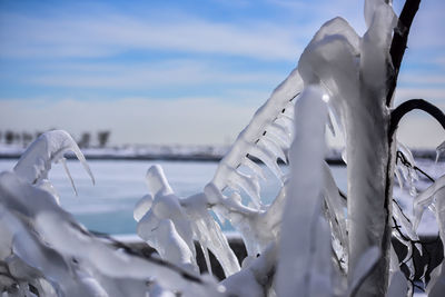 Close-up of frozen sea against sky