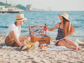 Happy couple at beach during picnic