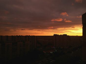 Cityscape against sky during sunset