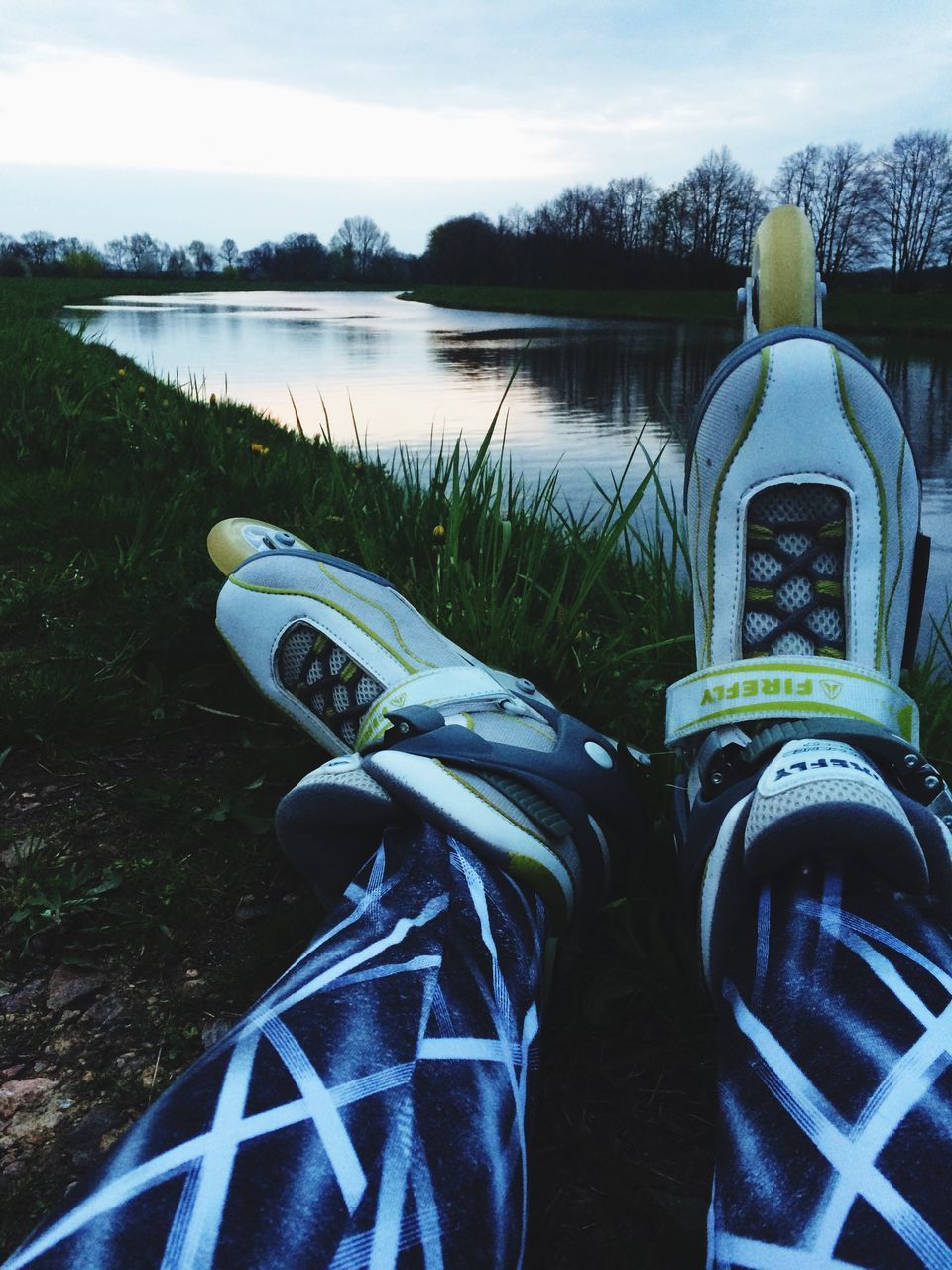 water, low section, personal perspective, person, shoe, lake, leisure activity, lifestyles, relaxation, sky, river, footwear, jeans, nature, sitting, tranquility, men