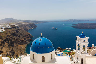 High angle view of church by sea against clear sky