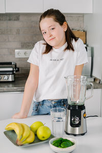 Portrait of girl in kitchen at home