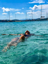 Man swimming in sea