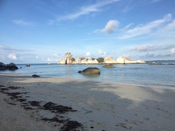 Scenic view of beach against sky