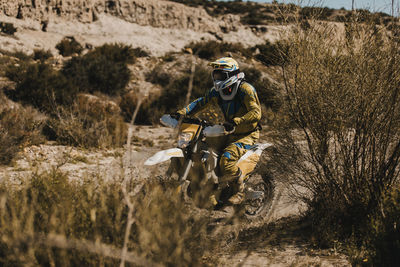 Man riding motorcycle on field