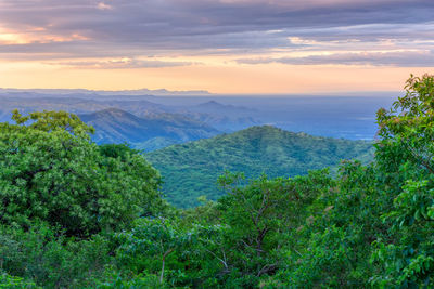 Scenic view of landscape against sky during sunset