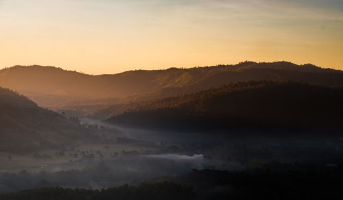 Scenic view of mountains against sky during sunset