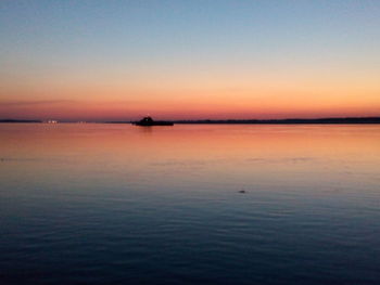 Scenic view of sunset over calm sea