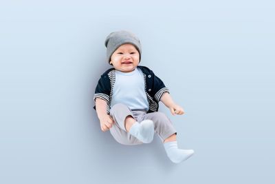 Full length of baby boy lying down on floor