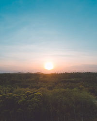 Scenic view of landscape against sky during sunset