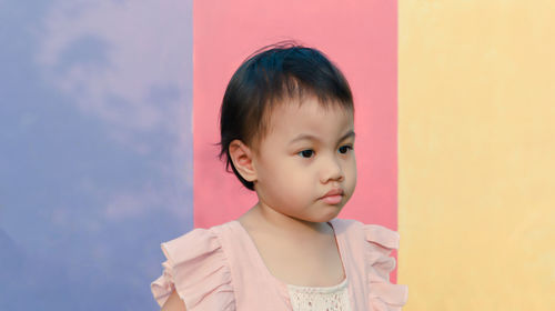 Portrait of cute girl looking away